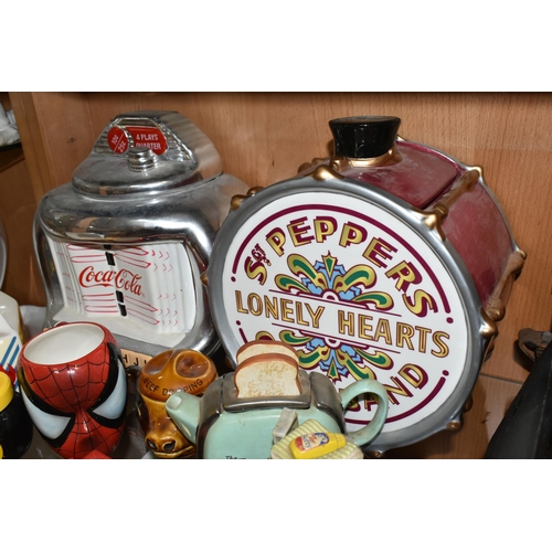 383 - A COLLECTION OF CERAMIC COOKIE JARS AND NOVELTY TEAPOTS, comprising an official Beatles Merchandise ... 