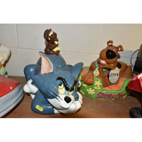 396 - FIVE CARTOON THEMED COOKIE JARS, comprising Fred Flintstone, Betty and Wilma, Tom & Jerry, Scooby Do... 