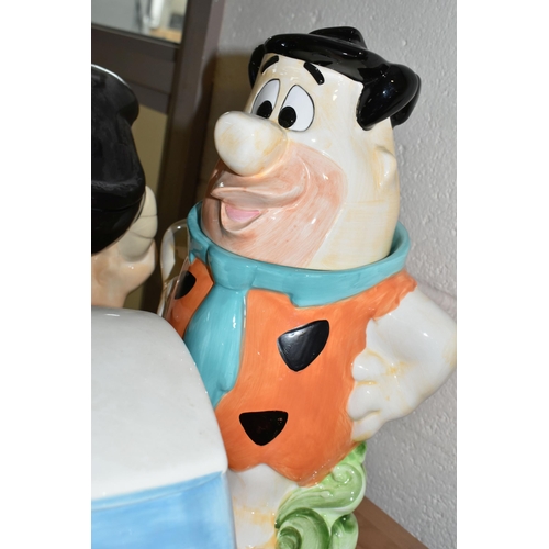 396 - FIVE CARTOON THEMED COOKIE JARS, comprising Fred Flintstone, Betty and Wilma, Tom & Jerry, Scooby Do... 