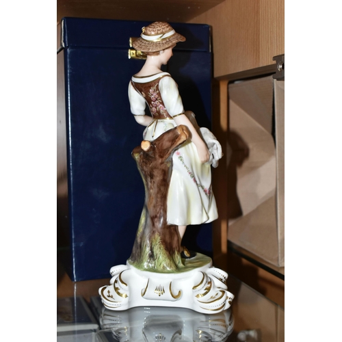 397 - A BOXED ROYAL CROWN DERBY SHEPHERDESS FIGURINE, she is depicted holding a lamb in her apron and a cr... 