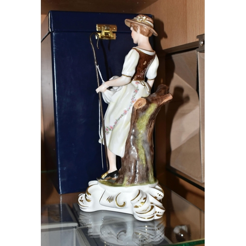 397 - A BOXED ROYAL CROWN DERBY SHEPHERDESS FIGURINE, she is depicted holding a lamb in her apron and a cr... 