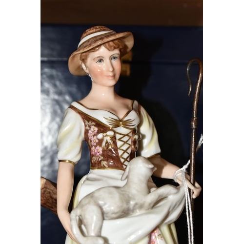 397 - A BOXED ROYAL CROWN DERBY SHEPHERDESS FIGURINE, she is depicted holding a lamb in her apron and a cr... 