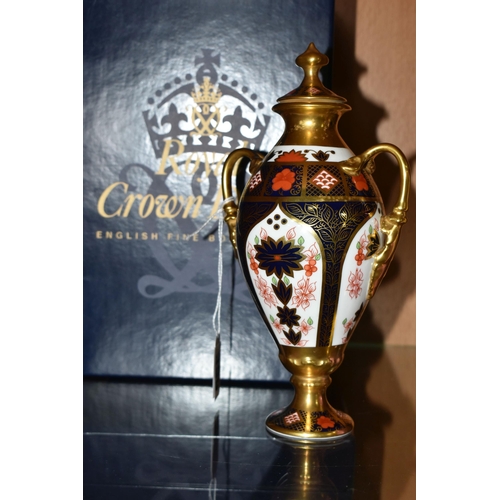 399 - A BOXED ROYAL CROWN DERBY TWIN HANDLED URN, complete with cover, 1128 pattern, approximate height 20... 