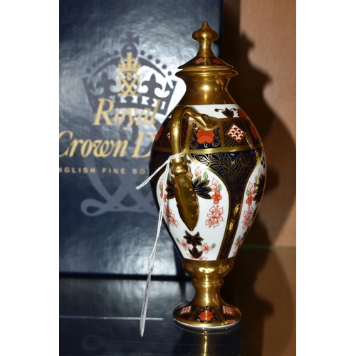 399 - A BOXED ROYAL CROWN DERBY TWIN HANDLED URN, complete with cover, 1128 pattern, approximate height 20... 