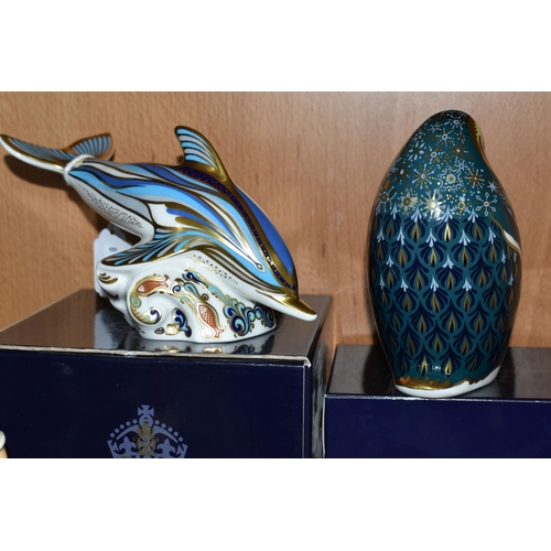 401 - TWO BOXED ROYAL CROWN DERBY 21st ANNIVERSARY PAPERWEIGHTS, comprising a striped Dolphin with gold an... 