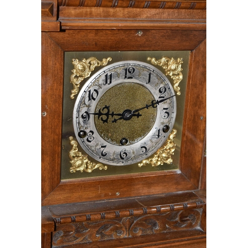 434 - AN EARLY 20TH CENTURY WALNUT CASED CHIMING BRACKET CLOCK, the caddy hood with foliate carved detail,... 