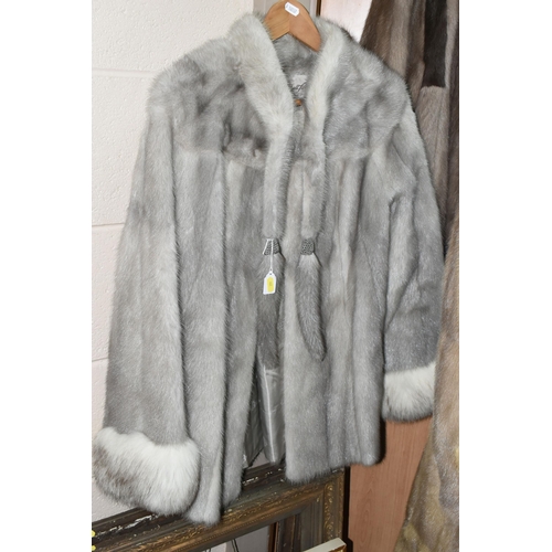 442 - THREE LADIES' FUR COATS, comprising a silver fur example with white fur cuffs, and a brown for examp... 