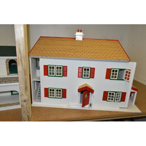 459 - TWO WOODEN DOLL'S HOUSES, one modelled as a detached house with side garage, front opening, the othe... 