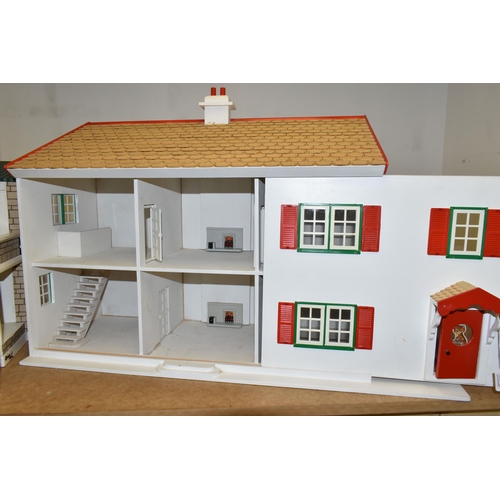 459 - TWO WOODEN DOLL'S HOUSES, one modelled as a detached house with side garage, front opening, the othe... 