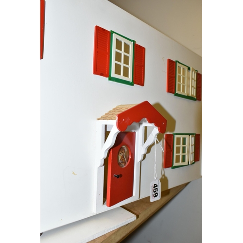 459 - TWO WOODEN DOLL'S HOUSES, one modelled as a detached house with side garage, front opening, the othe... 