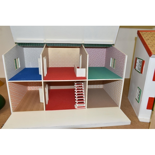 459 - TWO WOODEN DOLL'S HOUSES, one modelled as a detached house with side garage, front opening, the othe... 