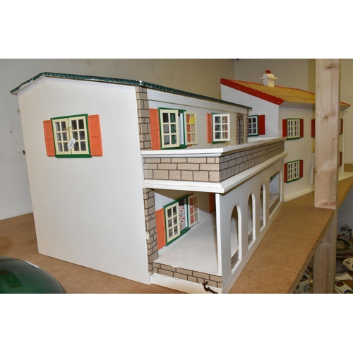 459 - TWO WOODEN DOLL'S HOUSES, one modelled as a detached house with side garage, front opening, the othe... 