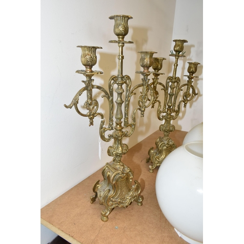 463 - A GROUP OF LIGHTING RELATED ITEMS, comprising a pair of three sconce brass candelabra, a brass finis... 