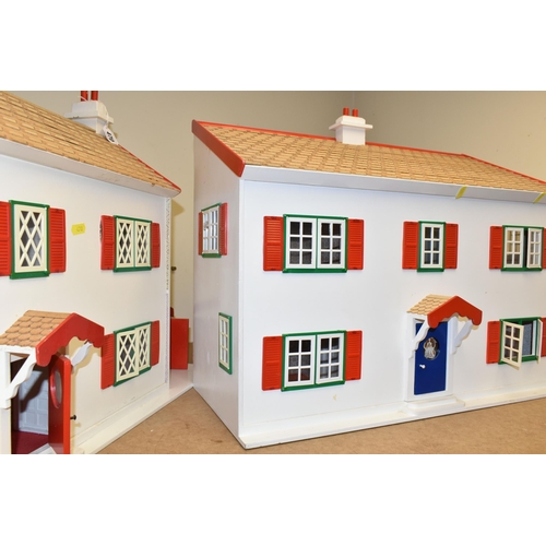 470 - TWO WOODEN DOLL'S HOUSES, modelled as a detached house with side garage, front opening, no furniture... 