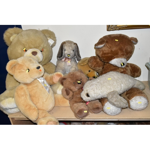 482 - A LARGE QUANTITY OF TEDDY BEARS AND SOFT TOYS, to include a Marks & Spencer 'Winnie The Pooh' hot wa... 