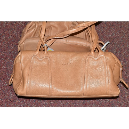 483 - TWO TAN COLOURED RADLEY HANDBAGS, approximate widths 26cm and 36cm, Condition Report: both appear to... 