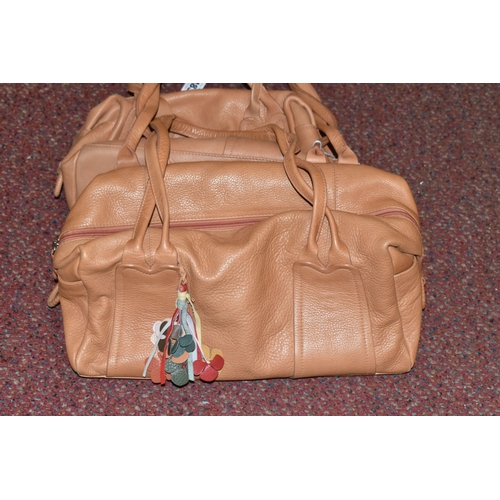 483 - TWO TAN COLOURED RADLEY HANDBAGS, approximate widths 26cm and 36cm, Condition Report: both appear to... 