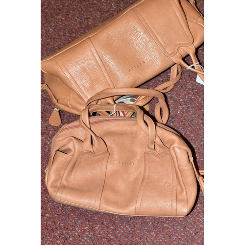 483 - TWO TAN COLOURED RADLEY HANDBAGS, approximate widths 26cm and 36cm, Condition Report: both appear to... 