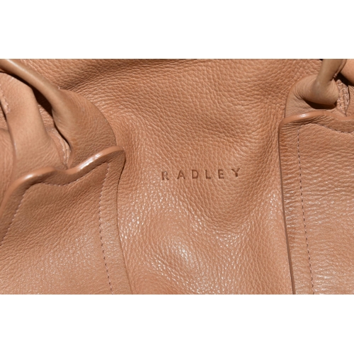 483 - TWO TAN COLOURED RADLEY HANDBAGS, approximate widths 26cm and 36cm, Condition Report: both appear to... 