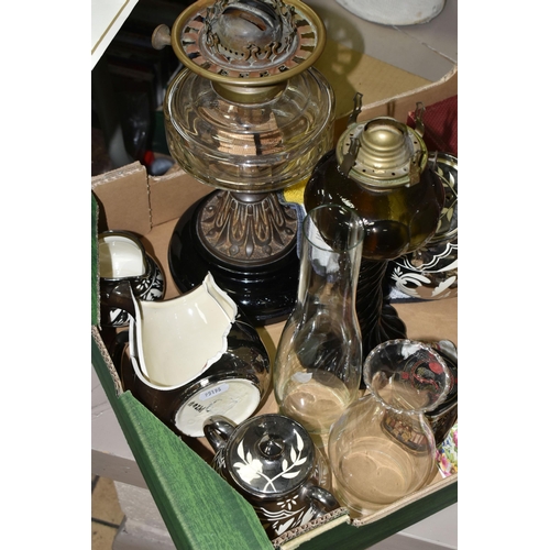 529 - A BOX OF CERAMICS, OIL LAMPS, METAL WARES AND SUNDRY ITEMS, to include five elephants from the Wade ... 