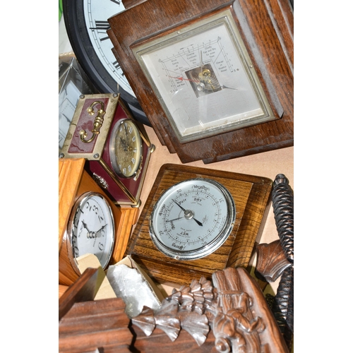 531 - A BOX AND LOOSE CLOCKS AND BAROMETER, including a modern cuckoo clock fitted with Reuge musical move... 