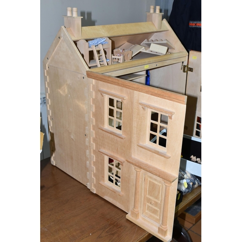 557 - A CHILD'S WOODEN DOLLS HOUSE AND ACCESSORIES, natural wood finish, comes with small workshop, dolls,... 