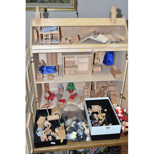 557 - A CHILD'S WOODEN DOLLS HOUSE AND ACCESSORIES, natural wood finish, comes with small workshop, dolls,... 