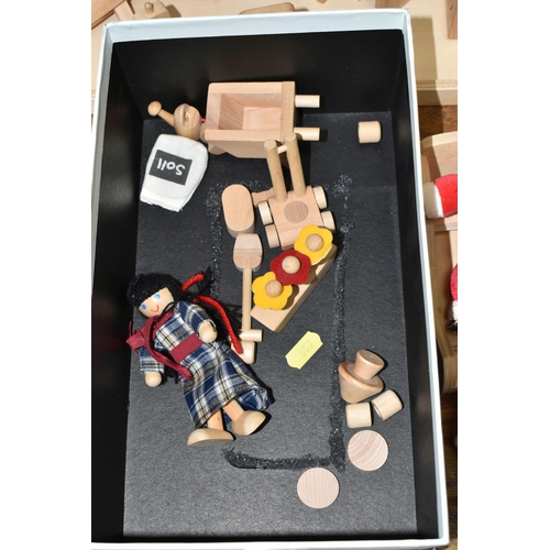 557 - A CHILD'S WOODEN DOLLS HOUSE AND ACCESSORIES, natural wood finish, comes with small workshop, dolls,... 