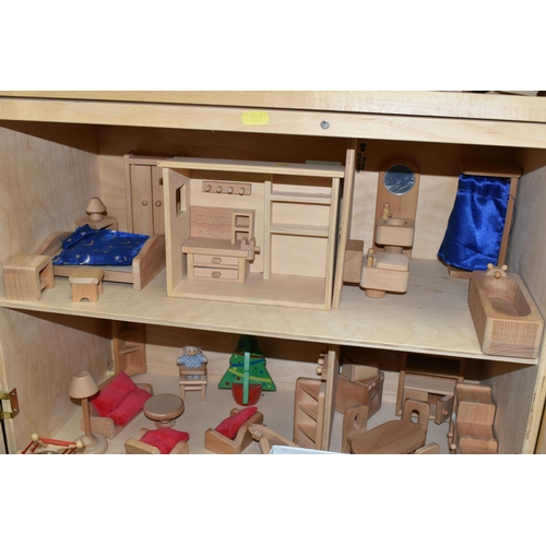 557 - A CHILD'S WOODEN DOLLS HOUSE AND ACCESSORIES, natural wood finish, comes with small workshop, dolls,... 