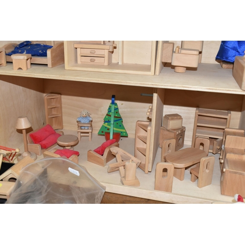 557 - A CHILD'S WOODEN DOLLS HOUSE AND ACCESSORIES, natural wood finish, comes with small workshop, dolls,... 