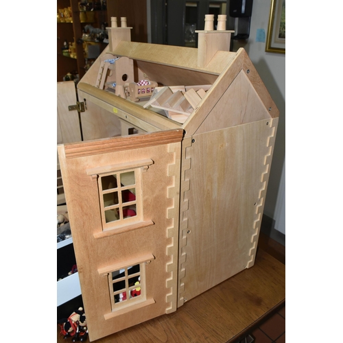 557 - A CHILD'S WOODEN DOLLS HOUSE AND ACCESSORIES, natural wood finish, comes with small workshop, dolls,... 