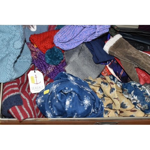 560 - A RAIL OF LADIES WINTER CLOTHING AND A VINTAGE TRAVELLING TRUNK, comprising a Laura Ashley cape, Win... 