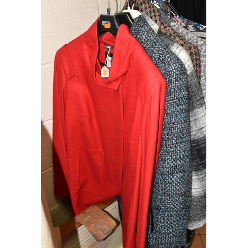 560 - A RAIL OF LADIES WINTER CLOTHING AND A VINTAGE TRAVELLING TRUNK, comprising a Laura Ashley cape, Win... 