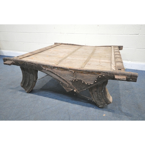 1201 - A MOROCCAN / ANGLO-INDIAN IRON BANDED AND HARDWOOD COFFEE TABLE, on a shaped base, 130cm x depth 132... 