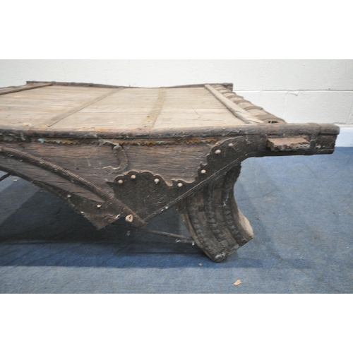 1201 - A MOROCCAN / ANGLO-INDIAN IRON BANDED AND HARDWOOD COFFEE TABLE, on a shaped base, 130cm x depth 132... 