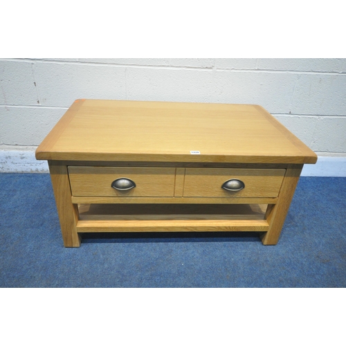 1228 - A MODERN OAK EFFECT COFFEE TABLE, with a double sided single drawer, length 96cm x depth 60cm x heig... 