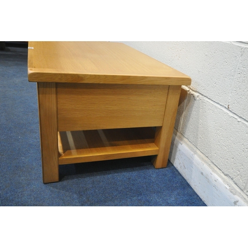 1228 - A MODERN OAK EFFECT COFFEE TABLE, with a double sided single drawer, length 96cm x depth 60cm x heig... 