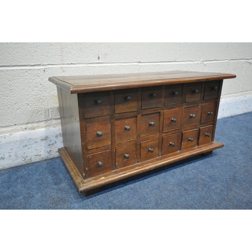 1231 - A REPRODUCTION HARDWOOD TABLE TOP APOTHECARY CHEST, fitted with eighteen drawers, on bracket feet, w... 