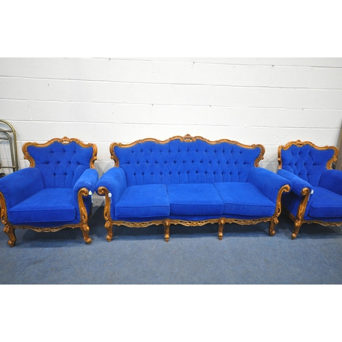 1277 - A REPRODUCTION FRENCH THREE PIECE LOUNGE SUITE, with flamboyant scrolled carving and detail, on fron... 