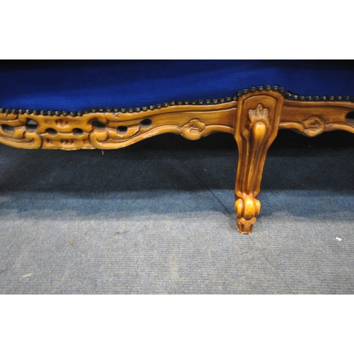 1277 - A REPRODUCTION FRENCH THREE PIECE LOUNGE SUITE, with flamboyant scrolled carving and detail, on fron... 