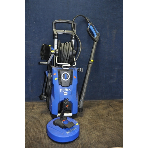 1055 - A NILFISK E140.3 PRESSURE WASHER with lance, patio and car brushes (PAT pass and working)