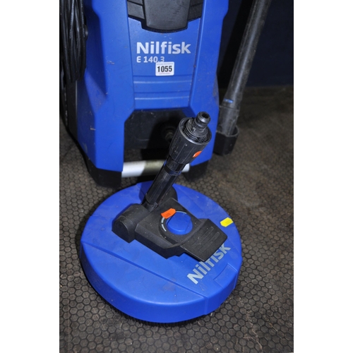 1055 - A NILFISK E140.3 PRESSURE WASHER with lance, patio and car brushes (PAT pass and working)