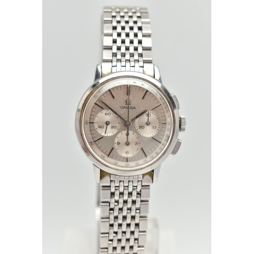 1 - AN 'OMEGA' WRISTWATCH, circa 1965, hand wound movement, round silvered chronograph tachymeter dial, ... 