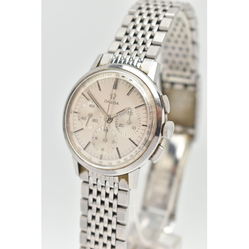 1 - AN 'OMEGA' WRISTWATCH, circa 1965, hand wound movement, round silvered chronograph tachymeter dial, ... 