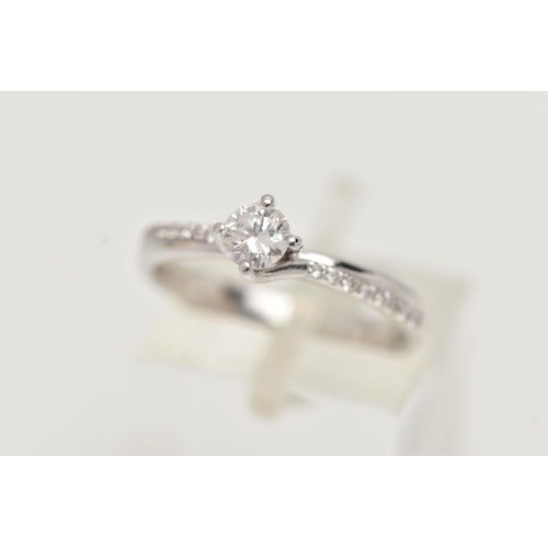 17 - A MODERN 18CT WHITE GOLD DIAMOND RING, a round brilliant cut diamond with faceted girdle, approximat... 