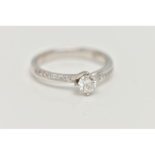 17 - A MODERN 18CT WHITE GOLD DIAMOND RING, a round brilliant cut diamond with faceted girdle, approximat... 