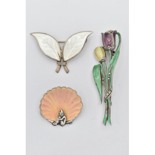 20 - A 'DAVID ANDERSEN' BROOCH AND TWO ADDITIONAL BROOCHES, a double leaf brooch with white enamel detail... 