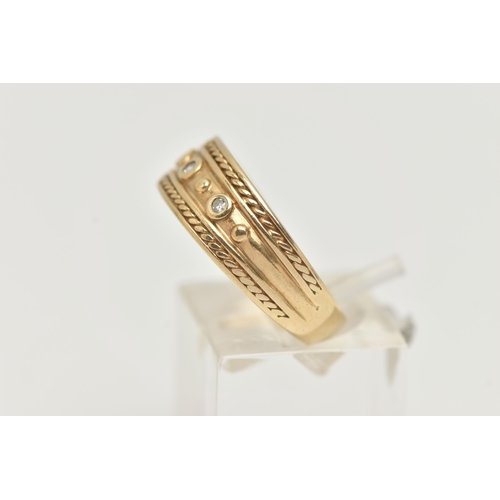 23 - A 9CT GOLD BAND RING, a yellow gold tapered band with rope detail, set with three single cut diamond... 