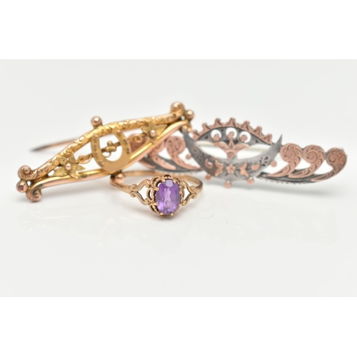 25 - A RING AND TWO BROOCHES, an oval cut amethyst, prong set in yellow gold, leading on to scrolled bifu... 