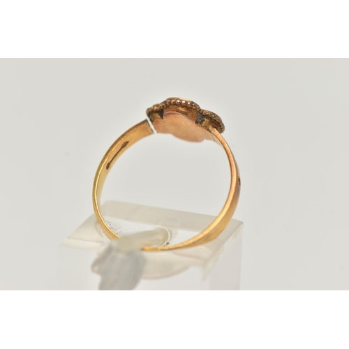 27 - A LATE VICTORIAN 18CT GOLD AND DIAMOND RING, a single rose cut diamond, set in a quatrefoil design m... 